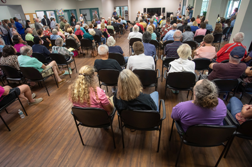 People in a room meeting with Mayor Donna Deegan