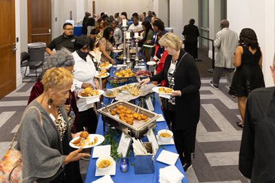 people eating from buffett