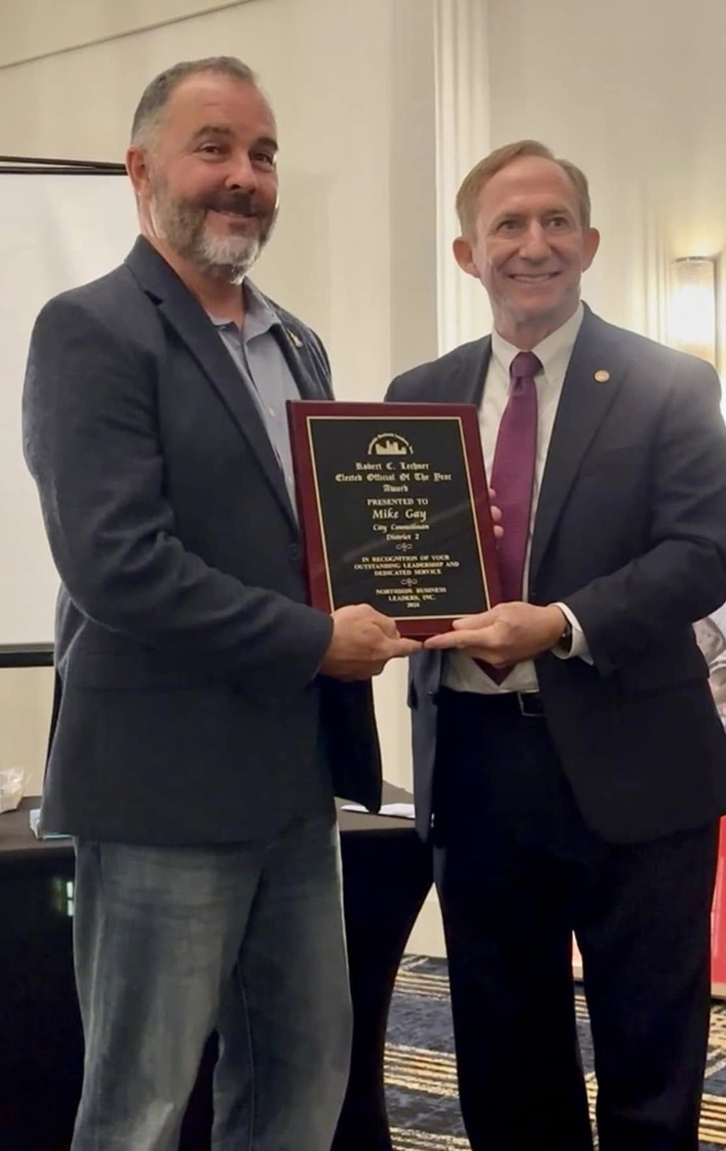 Council Member Mike Gay accepting the Elected Offical of the Year award at the Northside Business Leaders Annual Banquet. Also Pictured Master of Ceremonies Jerry Holland.