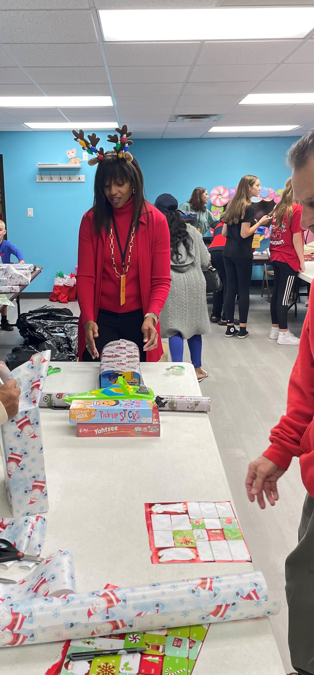 CM Clark-Murray wrapping gifts for participants.