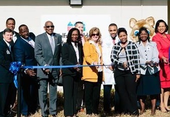 January 25, 2018 photo of Council Member Reggie Brown and colleagues at the ribbon cutting event for Wolfson Children's School-Based Health Centers. 