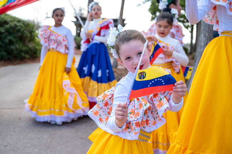 child dressed in costume to perform at world of nations