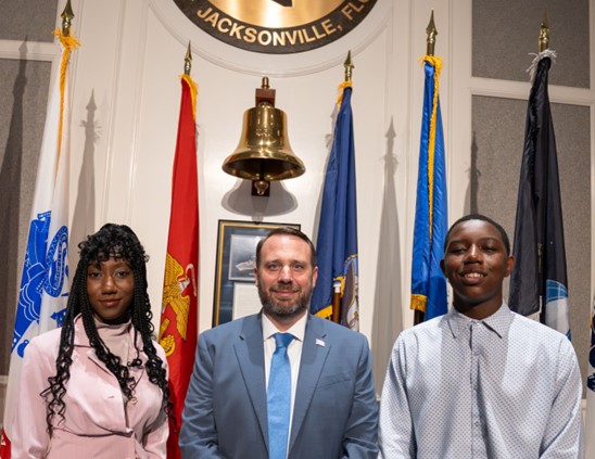 Page Program participant Chrissette Williams, CP Carrico, Page Program participant Aisha Williams, Jr., on November 25, 2025 at the City Council meeting.