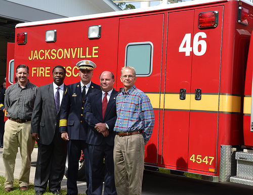Photo of Council Member Doyle Carter, Council Member Ray Holt, Mayor Alvin Brown, Fire Chief Marty Senterfitt, and Baldwin Mayor Stan Totman all standing beside the new Baldwin Rescue Unit.
