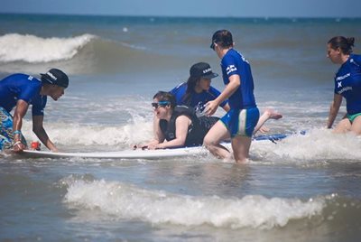 Surfer coming off a swell at the 9th Annual Brooks parasurfing event with Life Rolls On