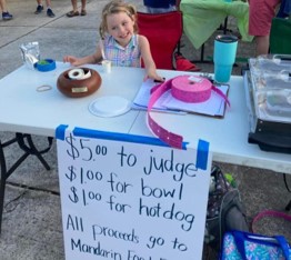 cute child at ticket table