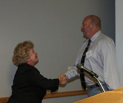 Kevin-Songer-being-presented-the-Christi-Veleta-Award-by-Christi-Veleta