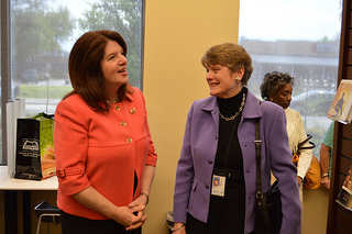 Photo of Council Member Lori Boyer speaking with Library Director Barbara Gubbin.