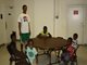 Group of children taking a break from outdoor play - inside Joe James Community Center