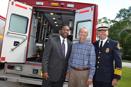 Photo of Council Member Carter with Mayor Alvin Brown and Fire Chief Marty Senterfitt standing in front of the open backdoors of the new Baldwin Rescue Unit.