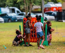 children with giant yard game