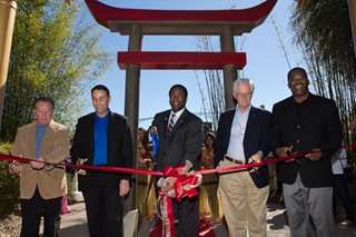Photo of Council President Gulliford, with Mayor Brown, Council Member Redman, and Council Member Gaffney cutting the ribbon to open the Land of the Tiger exhibit at the Zoo.