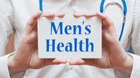 hands holding card written Men's Health