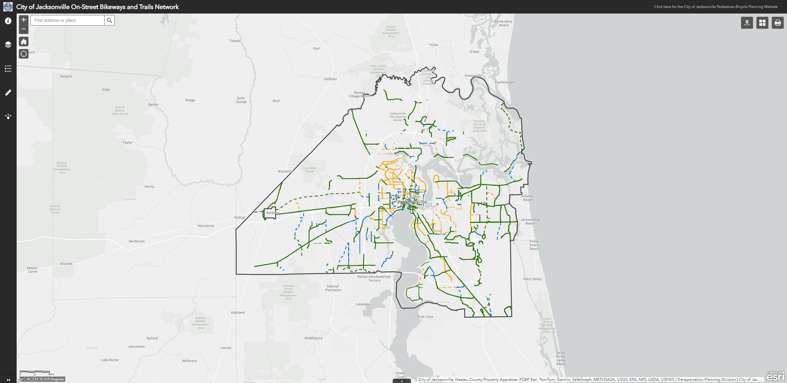A static screenshot of the interactive bikeways and trails network web map. A bold, red border outlines the city limits of Jacksonville, and multicolored lines within the city boundary denote the status of every bikeway project in the City.