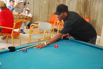 Playing pool at a community center