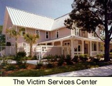 Photograph of the Victim Services Center, a pink two-story building located in the historic Springfield area of Jacksonville.