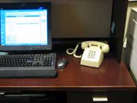 Hotline phone on desk.