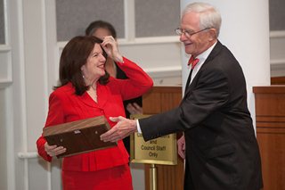 Photo of Council President Bill Gulliford presenting Council Member Lori Boyer an award for her work on the Task Force on Consolidated Government.