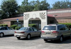 Longbranch Senior Center exterior building with cars and parking lot