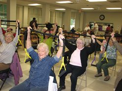 Seniors exercising with fitness bands