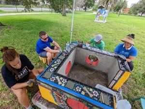 People working on mosaic