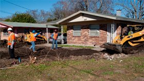 Project New Ground workers clean up.