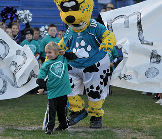 Photo of Luke Akerstrom with Jacksonville Jaguars mascot Jaxson DeVille.