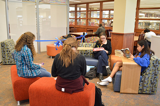 Photo of the students enjoying the lounge area in the new Teen Scene space at the San Marco Branch Library.