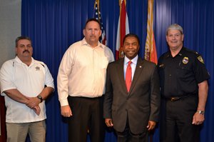 From left: Steve Amos, Fraternal Order of Police; Randy Wyse, Jacksonville Association of Fire Fighters; Mayor Alvin Brown; Assistant Chief Bobby Deal, Chair of the Police and Fire Pension Fund Board of Trustees