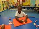 Young boy creating a craft project during Kids Kamp at R.F. Kennedy