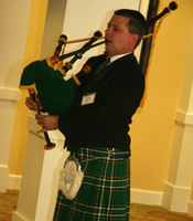 Jack Webb playing Amazing Grace on bag pipes