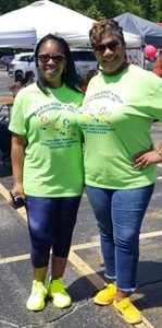 volunteers in green shirts