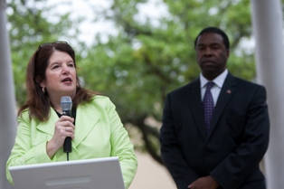 Photo of Councilwoman Lori Boyer addressing the audience from the Balis Gazebo as Mayor Alvin Brown looks on.