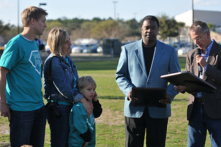 Photo of Council Member Doyle Carter and Mayor Alvin Brown with Luke Akerstrom and his family.
