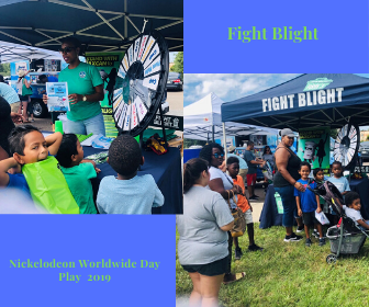 Parents and children lining up at Fight Blight booth