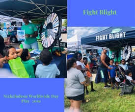 Parents and children lining up at Fight Blight booth