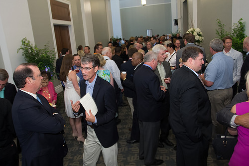 Photo of people at the reception held in the Conference Hall at the Main Library after the installation ceremony.