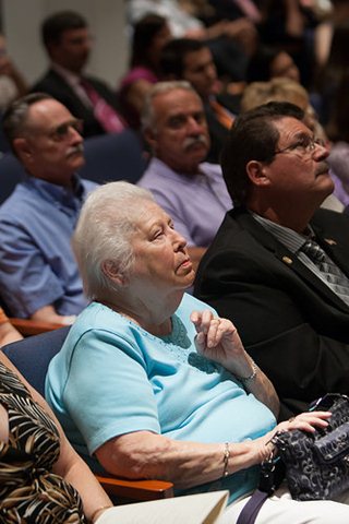 Photo of Arlington community activists Marcy Lowe and Mike Anania in the audience at the installation ceremony.